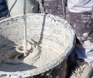 Mixing sand and cement render