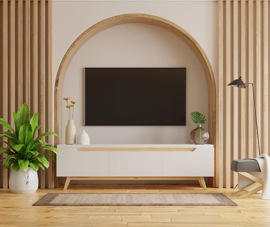 A wall mounted tv in an arch