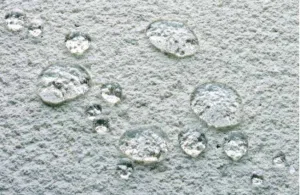 Water droplets on a water-repellent external render finish