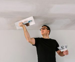 Plastering a ceiling