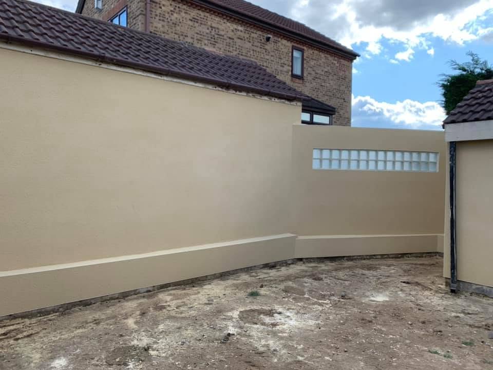 Finished rendered garden wall with glass block feature by P3 Plastering