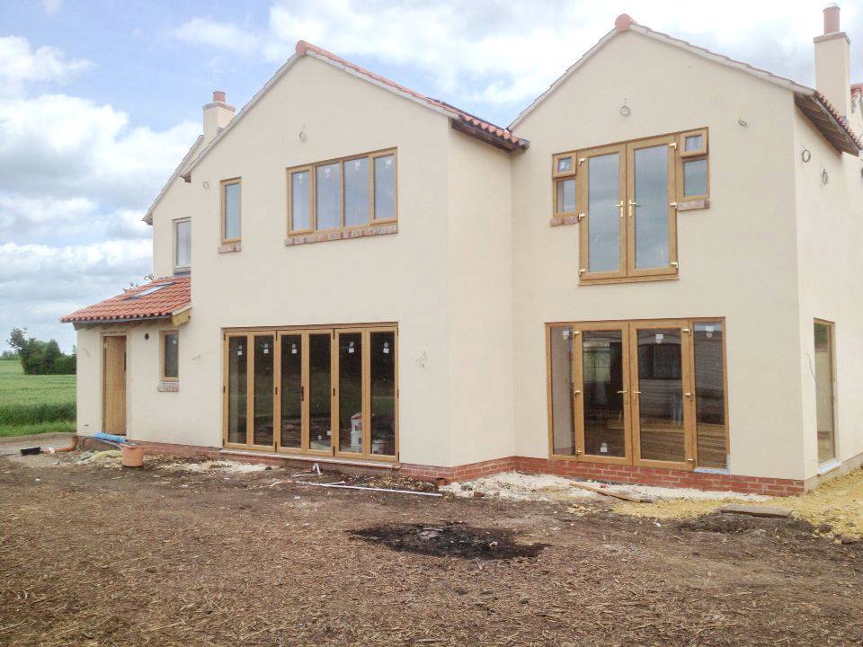 House finished with coloured render by P3 Plastering