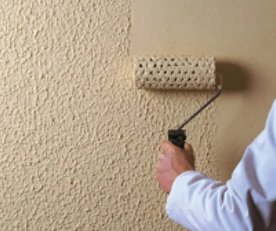 Textured exterior coating being applied with a roller