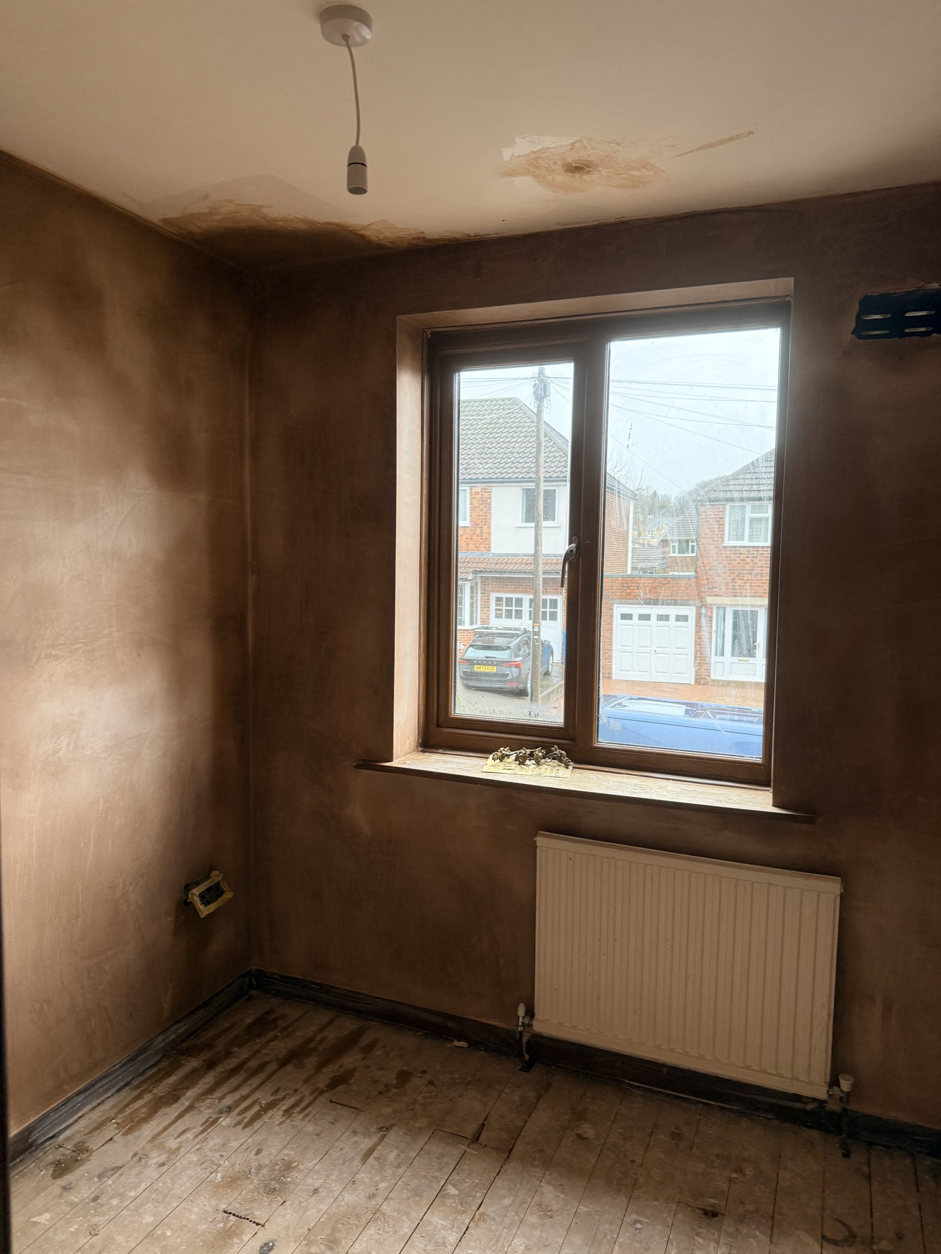 Freshly skimmed walls and ceiling around a window by P3 Plastering