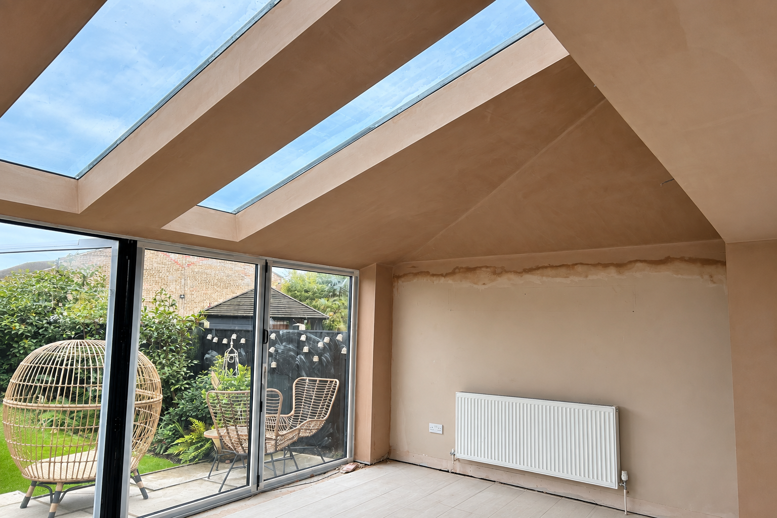 Freshly plastered interior with large glazed opening