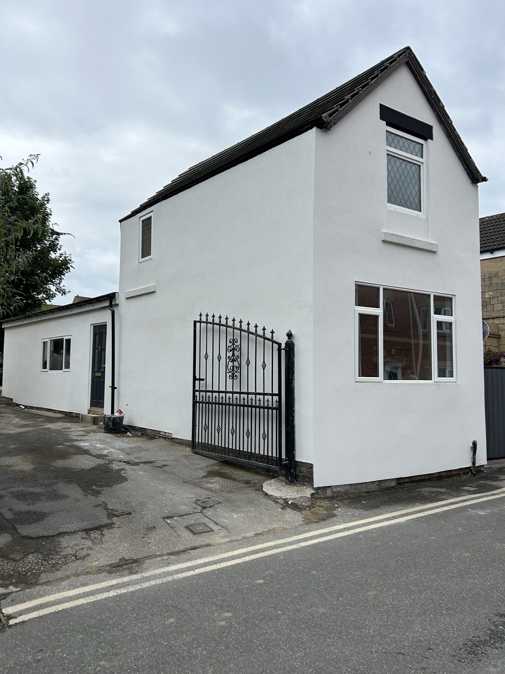 House with completed white exterior render by P3 Plastering