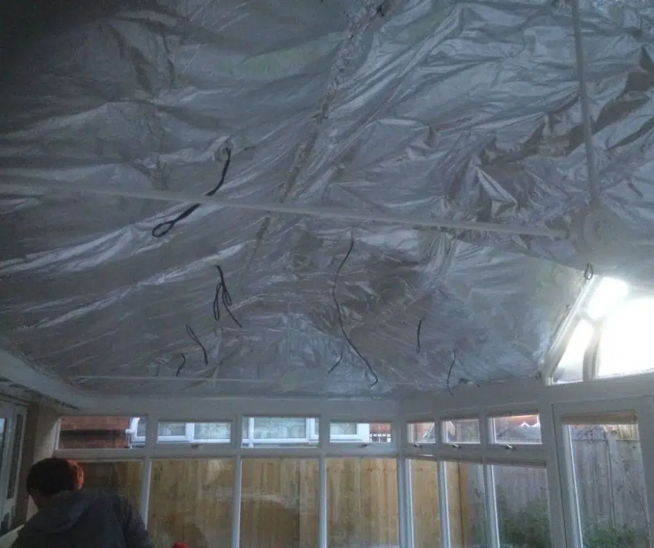 Insulation being installed within a conservatory roof by P3 Plastering