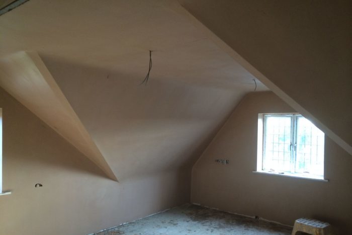 Freshly skimmed walls and ceiling in a loft room by P3 Plastering