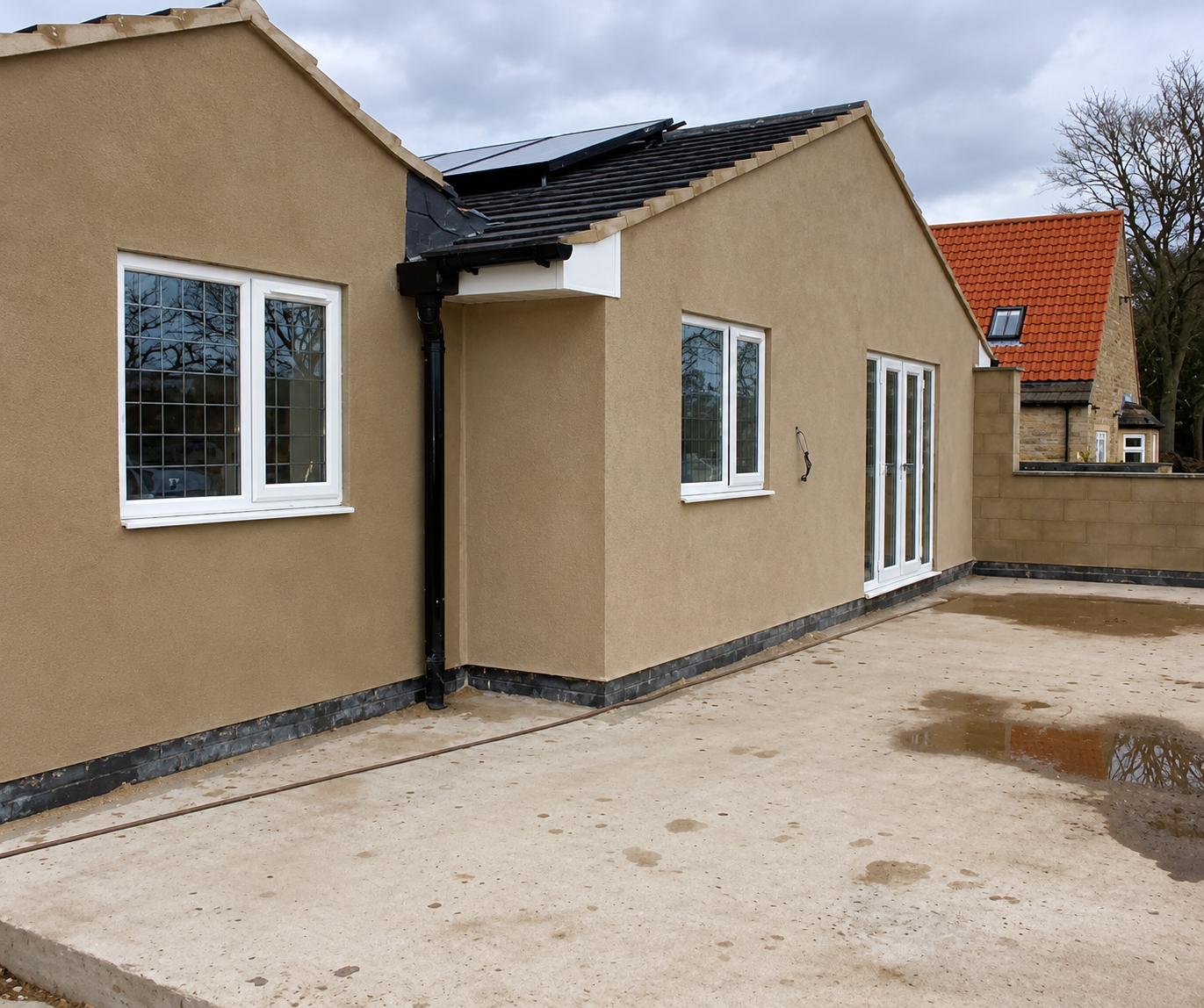 Property extension with a sand and cement rendered exterior finish