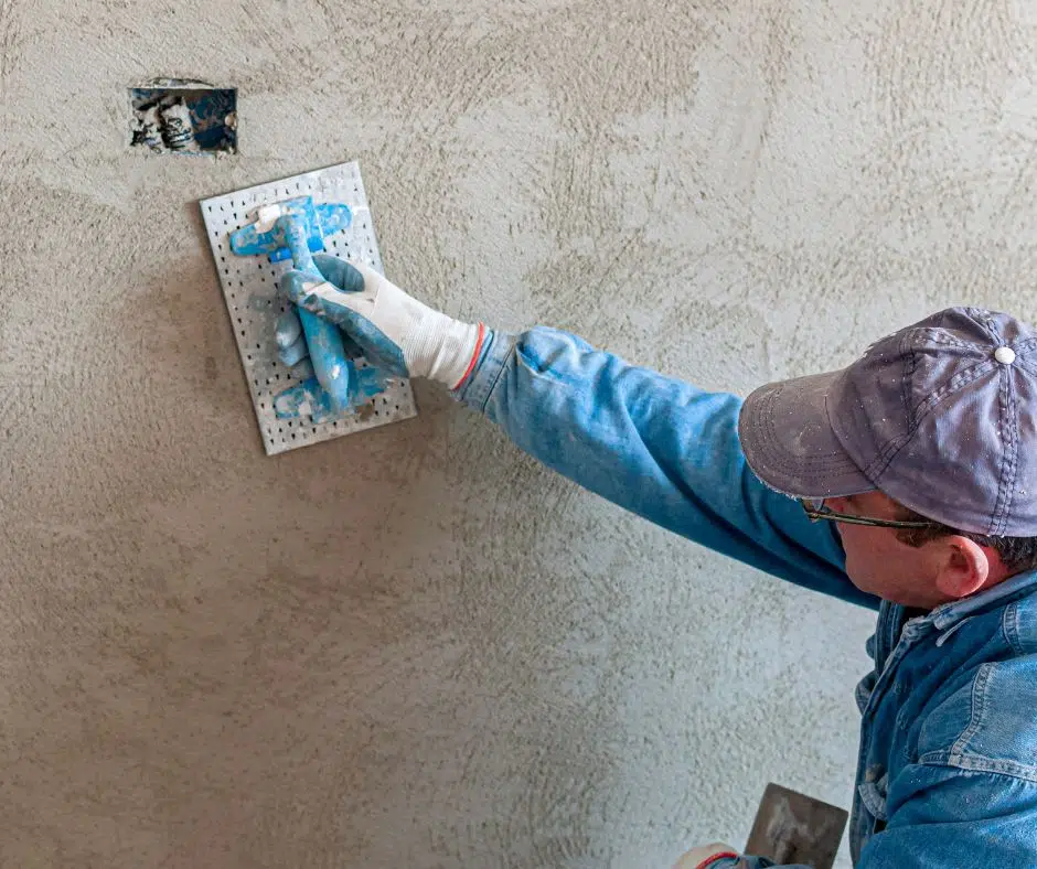 A plasterer applying solid plaster