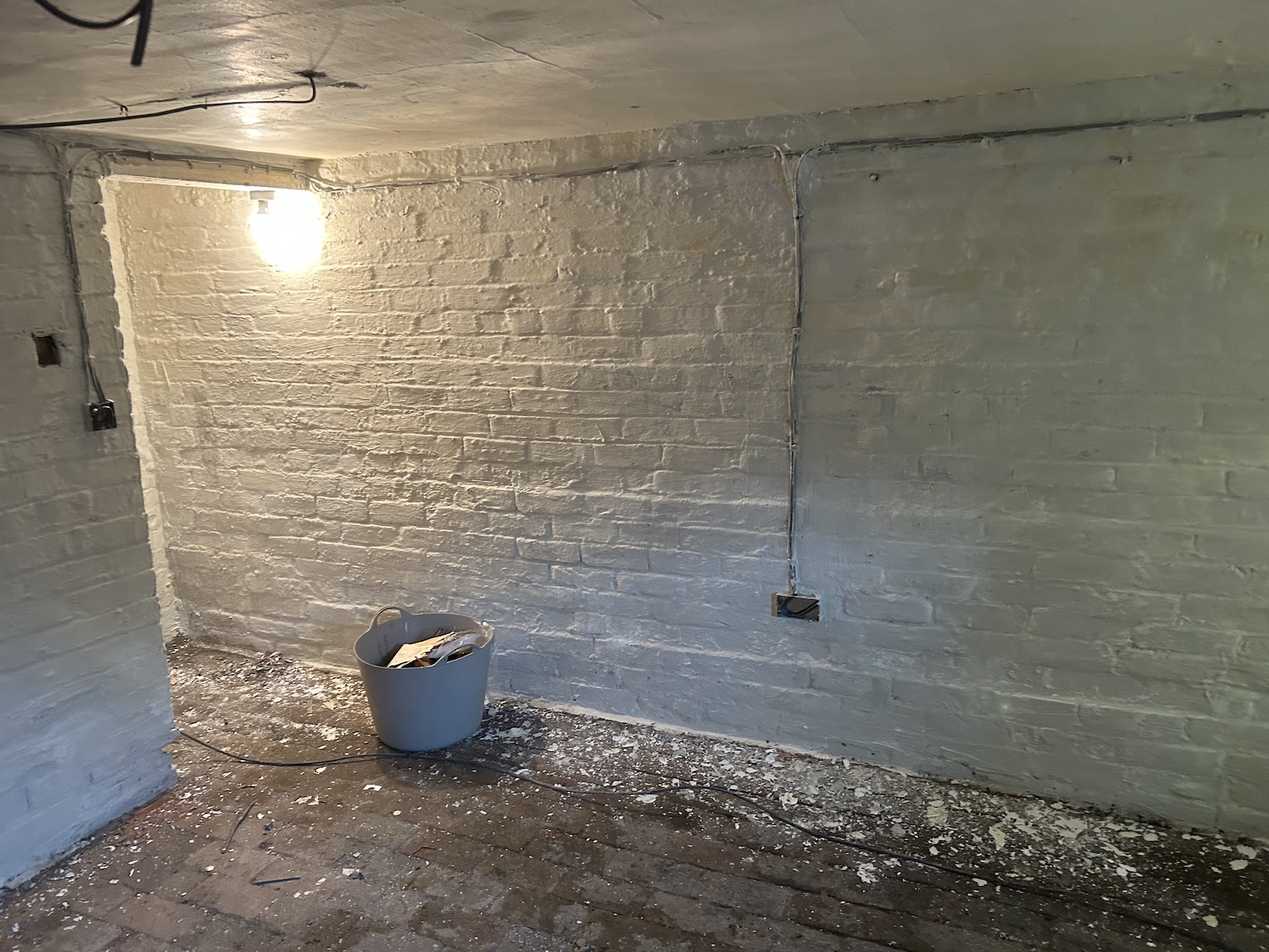 Traditional brick-built basement with specialist treatment applied to the masonry walls by P3 Plastering.