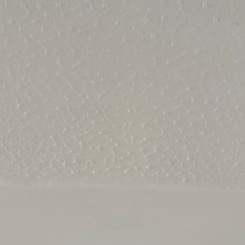 Artex ceiling before reskimming